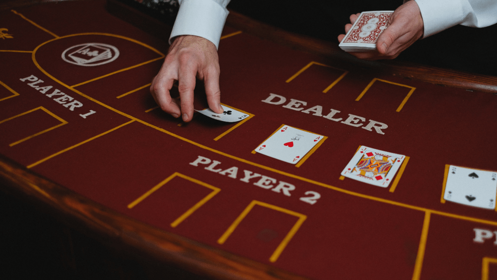 A person playing blackjack at a casino table