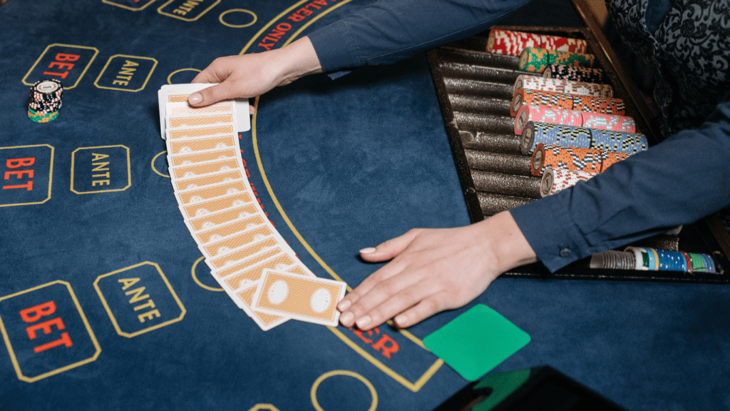 a person playing blackjack at a casino