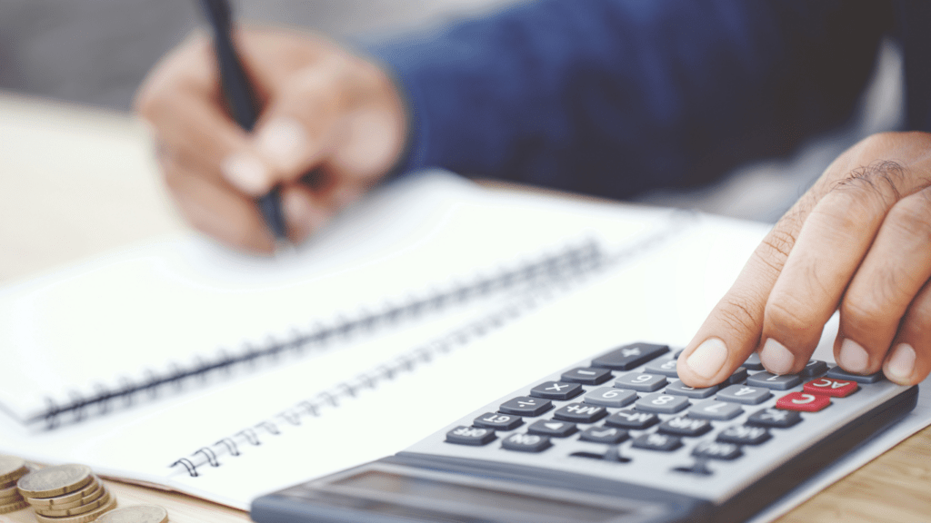 calculator and pen on a financial document