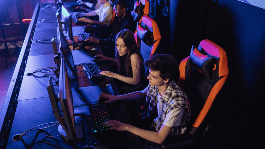 a group of people playing video games in a gaming room