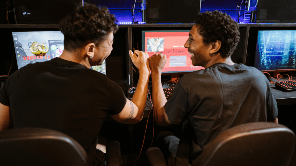 a group of people playing video games in a gaming room