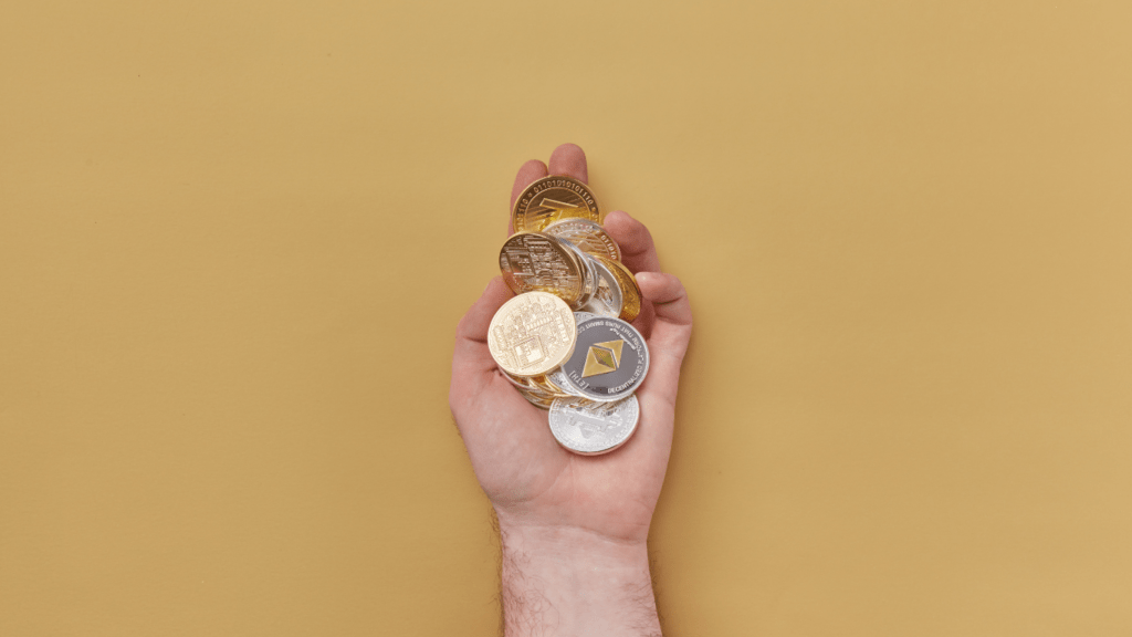 a person holding a crypto coin