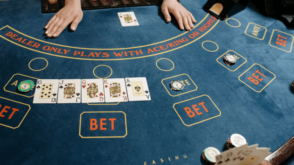 a person playing blackjack at a casino