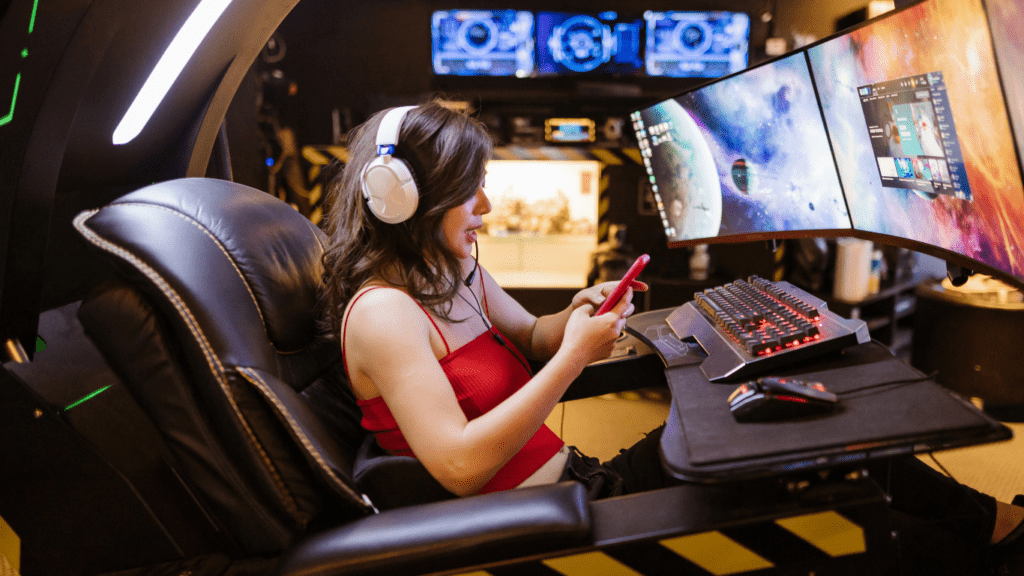 a person playing video games on three monitors