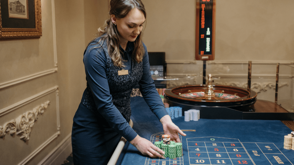 a person standing in front of a casino table