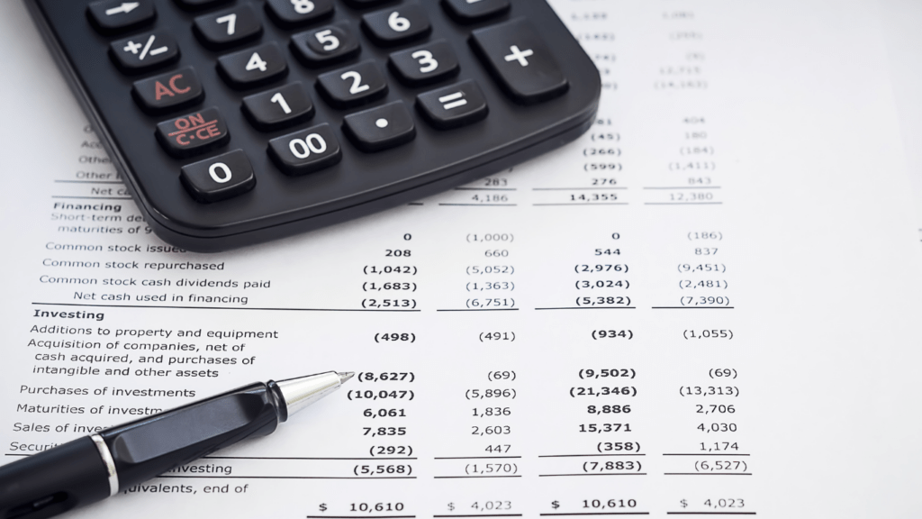 calculator and pen on a financial document