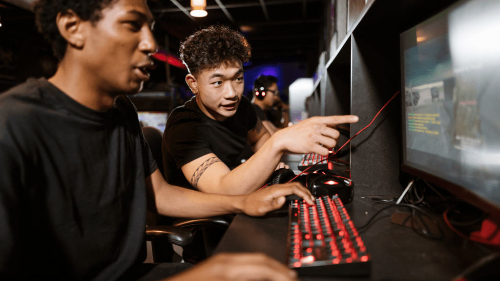 two people playing video games on a computer